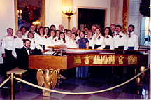 Members of the Connecticut Master Chorale, with accompanist Joseph Jacovino, surround the 1938 Steinway grand piano at the White House on Saturday. Former President Harry S. Truman played this same piano for President John F. Kennedy in 1961.